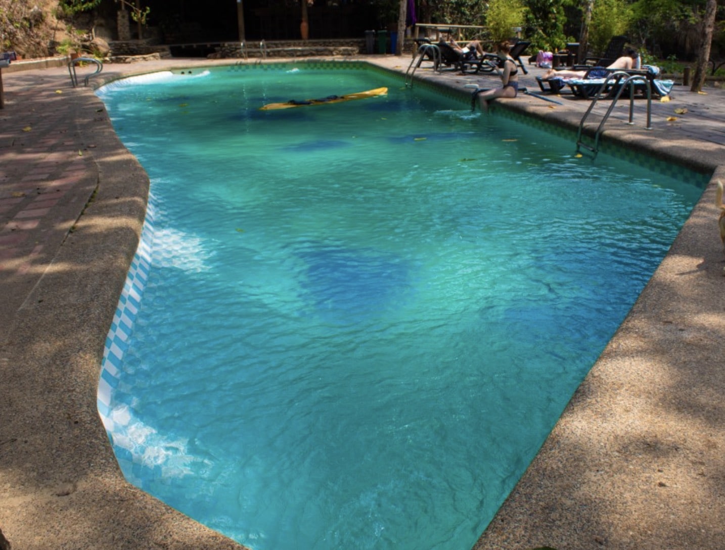 cleaning the bottom of the pool